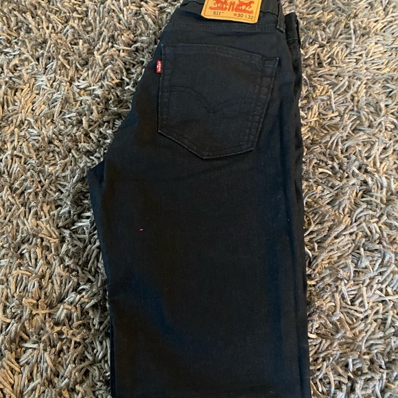 Levi's Other - Levi’s Men blue/black jeans with a coating.